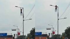 Kolkata man hangs from towering lamp post, performs pull-ups over busy road
