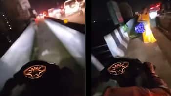 Traffic jam prompts scooter rider to take footpath, pedestrians forced aside | Viral
